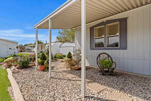 View of patio featuring an outdoor structure