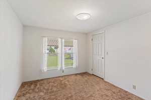 View of carpeted spare room