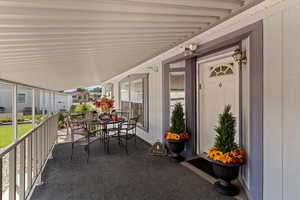 Covered porch with outdoor dining area