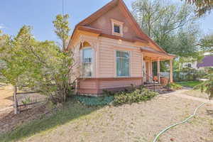 Rear view of property with a porch