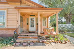 Property entrance with covered porch