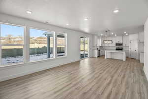 LARGE GREAT ROOM W/ LOTS OF WINDOWS FOR NATURAL LIGHT!(PICTURE OF PREVIOUS BUILT HOME-COLORS AND MATERIALS MAY VARY)