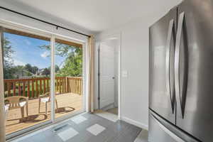 Dining room with baseboards and extra large sliding glass door