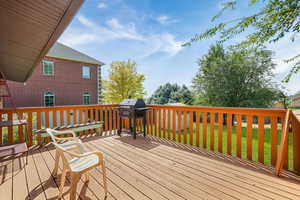 Deck featuring area for grilling