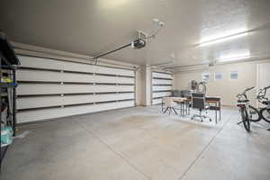 Garage featuring a garage door opener