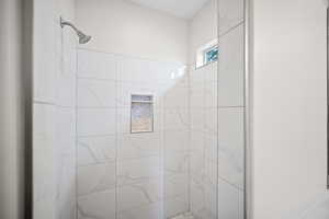 Full bath with a shower stall