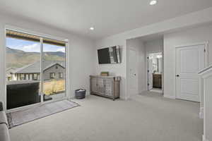 Carpeted bedroom featuring access to exterior, recessed lighting, and connected bathroom