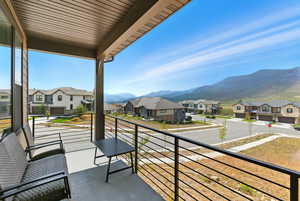 Balcony with a residential view and a mountain view