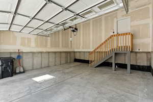 Garage featuring a garage door opener