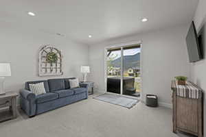 Living room featuring carpet floors and recessed lighting