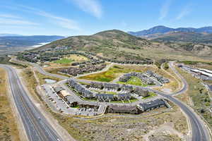 Aerial view of property's location with mountains and nearby suburban area