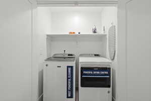 Washroom with washing machine and dryer