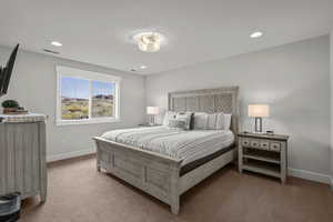 Carpeted bedroom with recessed lighting