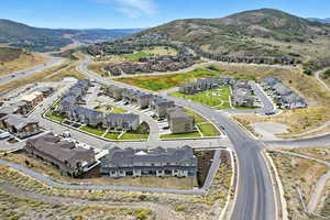 Aerial perspective of suburban area featuring a mountain backdrop