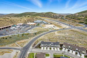 Aerial overview of property's location featuring a mountain backdrop