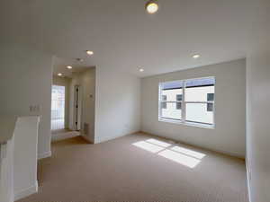 Loft featuring plenty of natural light, and recessed lighting