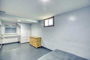Bedroom with baseboards and recessed lighting