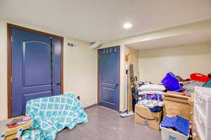 Interior space featuring baseboards and recessed lighting