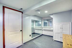 Bathroom featuring vanity and recessed lighting