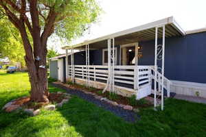 View of side of home featuring an exterior structure and an outbuilding