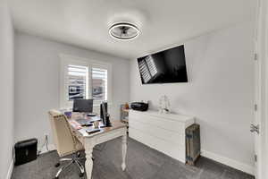 Office area with carpet floors and baseboards