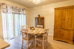 Dinning area with glass door to the deck