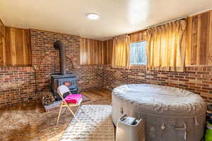 Family room in the basement with wood burning stove