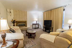 Living room with carpet and fire place