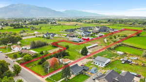 Aerial view of residential area featuring a mountain backdrop