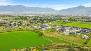 Aerial perspective of suburban area featuring a mountain backdrop