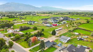 Aerial perspective of suburban area with a mountain backdrop