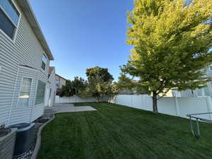 Fenced backyard with a patio area