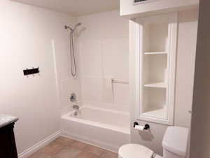 Full bathroom featuring vanity, bathtub / shower combination, and light tile patterned floors