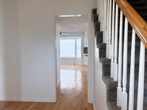 Main Entrance Hall with light wood-type flooring and stairs