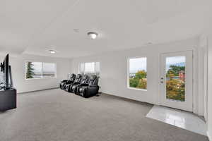 Living room featuring light colored carpet and baseboards