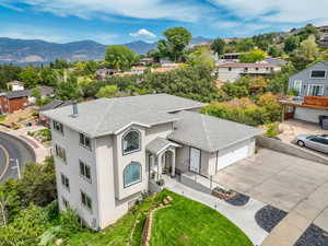 Aerial view of residential area featuring a mountainous background