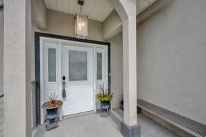 Entrance to property featuring stucco siding
