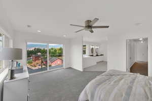 Carpeted bedroom with access to exterior, ceiling fan, recessed lighting, and ensuite bathroom
