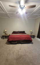 Master Bedroom with light colored carpet and a ceiling fan