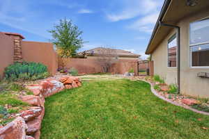 Fenced backyard with a gate