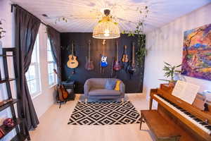 Sitting room featuring light wood-type flooring