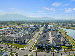 Aerial view of residential area featuring a water and mountain view