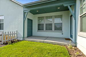 Exterior view of stucco siding and a skylight