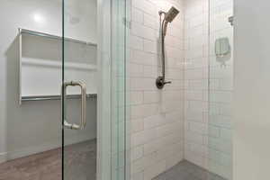 Full bathroom featuring a shower stall
