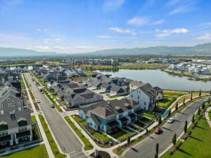 Aerial perspective of suburban area with a water and mountain view