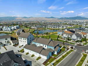 Aerial perspective of suburban area featuring a water and mountain view