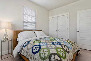Bedroom with carpet floors and a closet