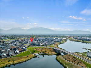 Aerial perspective of suburban area with a water and mountain view and a notable bridge