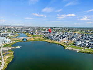 Aerial overview of property's location featuring nearby suburban area and a large body of water