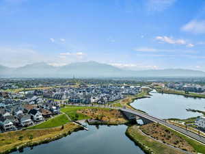 Aerial perspective of suburban area with a water and mountain view and a notable bridge